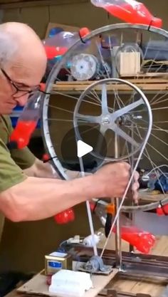 an older man working on a spinning wheel