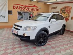 a white car parked in front of a store