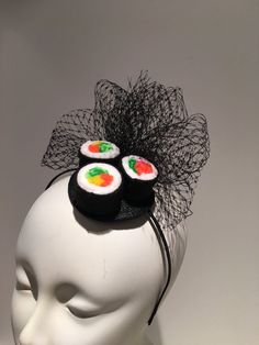 "Sushi Fascinator- Sushi headpiece- I love Sushi -Kentucky derby- Derby days- Halloween- Mad hatter headpiece -Polo - Food -Foodie- Mad Hatter Party Hello, This fascinator has three felt California rolls and a bird cage net puff ...It's perfect for a sushi lover and makes a great conversion piece. It's placed in a 1/8\" satin covered headband that's adjustable and very comfortable. -------------------------------------------------- I ship US Postal Service. USA DOMESTIC CHOICES (From mailed date Harajuku Style Black Costume Hat For Halloween, Black Harajuku Style Costume Hat For Halloween, Black Harajuku Style Halloween Costume Hats, Black Novelty Headband Costume Accessory, Novelty Black Headband Costume Accessory, Novelty Multicolor Mini Hats For Party, Whimsical Adjustable Costume Accessories, Fun Party Costume Accessories Headband, Fun Party Costume Accessories: Headband