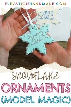 someone holding a snowflake ornament in their hand with the words, snowflake ornaments model magic