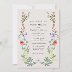 a wedding card with flowers and leaves on the front, featuring an ornate border design