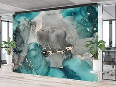 a large wall mural in an office with blue and grey paint on it's walls