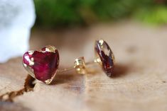 Heart Red Rose Flowers with 24K Gold Flakes Resin Stud Earrings A tiny heart shape floral stud earrings made with red rose petals and 24K Gold flakes in Eco resin into a gold plated over brass post and earring back. All natural ingredients gathered around my dwelling. Earrings diameter measure from 10mm. Please notice that the rings are truly handmade and some bubbles may appear since it is an artisan product from beginning to end. Every single one of my pieces has been uniquely designed by me w Red Heart-shaped Earrings For Her, Rose Gold Ruby Earrings For Gifts, Red Heart Earrings For Gift, Red Round Heart Earrings For Gift, Gold Flower Earrings For Valentine's Day, Gold Heart-shaped Flower Earrings, Elegant Red Heart Earrings For Gift, Heart-shaped Gold Flower Earrings For Valentine's Day, Gold Heart-shaped Flower Earrings For Valentine's Day