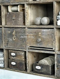 an old wooden shelf filled with lots of drawers