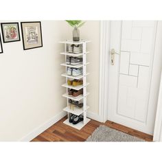 a tall white shelf with shoes on it