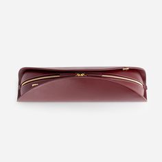 A moon-shaped clutch with a distinctive taco-like silhouette. Its bold size and sleek, minimal design make a powerful statement. It features a detachable shoulder strap for versatility and a secure zipper closure to keep your essentials safe. Crafted from Italian calf leather. Microsuede lining, adjustable and detachable strap, gold hardware. w:46 X h:21 X d:10 cm (18.1 X 8.3 X 3.4 in.) Shoulder drop: 46 - 56 cm (18.1 - 22 in.) Modern Clutch For Daily Use, Modern Soft Leather Clutch For Office, Modern Soft Leather Office Clutch, Modern Evening Clutch With Zipper Pocket, Modern Leather Clutch With Zipper Pouch, Modern Formal Clutch With Zipper Pocket, Modern Business Clutch With Smooth Grain, Modern Business Clutch With Zipper Pouch, Mlouye Bag