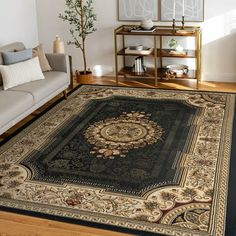 a living room filled with furniture and a rug on top of a hard wood floor