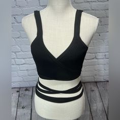 Nwt Olivaceous Black Ribbed Wrap Waist Crop Top V Neck Size Large 52% Rayon, 28% Nylon 20% Spandex 36”- Length Of Wrap Part Laying Flat 7”- Length Down Back Laying Flat Nwt- No Signs Of Wear Or Flaws Black Seamless Strappy Tops, Black Seamless Strappy Crop Top, Black Stretch Bandage Tops, Spring Bandage Black Top, Black Bandage Top For Spring, Trendy Black Bandage Crop Top, Black Bandage Crop Top For Spring, Chic Black Strappy Crop Top, Wrap Around Crop Top