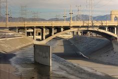 a bridge over a body of water with power lines above it