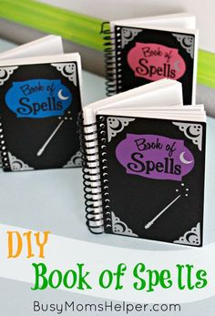 three books with the words diy book of spells written on them