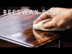 a person cleaning a wooden table with a cloth on it and the words beeswax polish how to get the best results