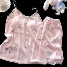 Kitty Ice Silk Satin Suspender Pajamas KI566 Transform your bedtime routine into an adorable and comfortable experience with our Kitty Ice Silk Satin Suspender Pajamas! Featuring a sleek and silky design, these pajamas will keep you cool and cozy throughout the night. Embrace the cuteness and comfort with every wear. Silky Design, Hello Kitty Summer, Sanrio Fashion, Suspender Shorts, Pink Kitty, Kawaii Sanrio, Bedtime Routine, Silk Pajamas, Chest Pad