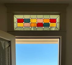 a bathroom window with a view of the ocean