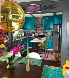 a dining room table with placemats and flowers on it