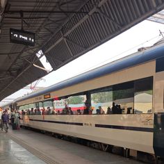 people are lined up to board the train