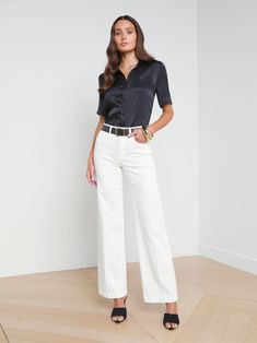 The wide-leg jean is having a moment, and our newest jean captures the silhouette beautifully. The Scottie jean hugs from high-rise contoured waistband to hip, before draping into a wide leg for a perfectly proportioned look. With a 32" inseam, it's the perfect sneaker jean. Add our Ellah blouse and a sandal for the ultimate in black-and-white sophistication. | L'AGENCE Scottie Wide-Leg Jean In Blanc Denim Sweater Jacket, Camel Blazer, Chic Summer Style, Perfect Sneakers, Lace Tee, Denim Sweater, Silk Charmeuse, Denim Flares, Bottom Clothes