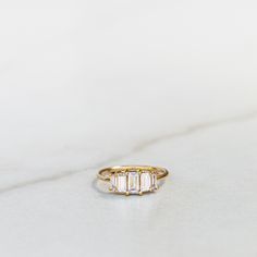 14k Gold Vermeil over .925 sterling silver. White CZ stone. Each piece is made by hand. We recommend using a soft cloth to clean your ring. Please do not use a silver polishing cloth as this will remove the gold plating. Keep your ring away from any beauty products or water to preserve it's look. Afrika Burn, Ring Ceremony, Ring My Bell, Rings Ceremony, Baguette Ring, Dream Engagement Rings, Rings Cool, Ring Ring, Cz Stone