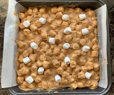 a pan filled with marshmallows on top of a counter