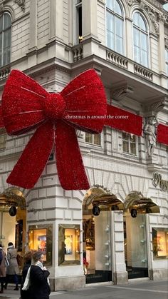 a large red bow on the side of a building