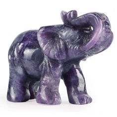 an elephant figurine made out of purple marbles on a white background,