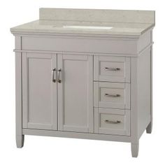 a white bathroom vanity with drawers and a marble counter top on an isolated white background