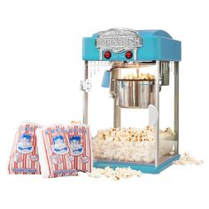 an old fashioned popcorn maker and two bags of popcorn