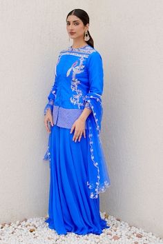 Royal blue short kurta embellished with bird and flower motif. Paired with a flared palazzo and a dupatta with scalloped embroidered border. - Aza Fashions Embellished Blue Kurta For Reception, Blue Embellished Kurta For Reception, Traditional Hand Embellished Blue Set, Designer Hand Embellished Blue Set, Designer Blue Hand Embellished Set, Kurta Palazzo Set, Flared Palazzo, Royal Blue Shorts, Short Kurta