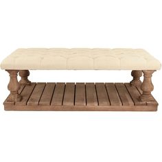 a wooden bench with a white cushion on top