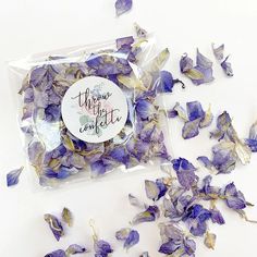 dried purple flowers in a plastic bag on a white surface with the words happy mother's day written on it