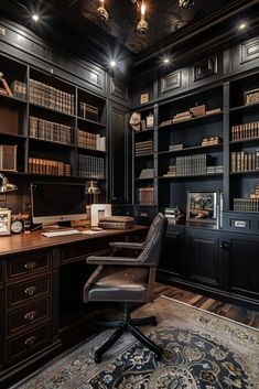 an elegant home office with black bookcases and leather chairs, along with a rug on the floor