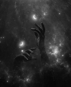 two hands reaching towards each other in front of stars and the sky with crescents