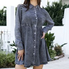 Elevate your casual chic with this Button-Down Tiered Denim Shirt Dress. Crafted from snow wash denim fabric, this dress offers a breathable and comfortable fit, perfect for all-day wear. With its loose tunic silhouette and flattering babydoll style, it's a versatile piece suitable for any occasion. Casual Collared Washed Denim Dress, Trendy Long Sleeve Washed Dress, Casual Washed Denim Dress For Fall, Casual Gray Dresses With Buttons, Casual Gray Dress With Buttons, Casual Gray Buttoned Dress, Casual Washed Button-up Dress, Casual Button-up Washed Dress, Chic Washed Long Sleeve Denim Dress