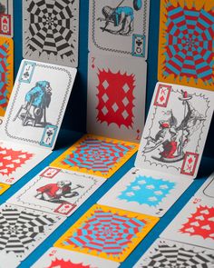 several playing cards with different designs on them