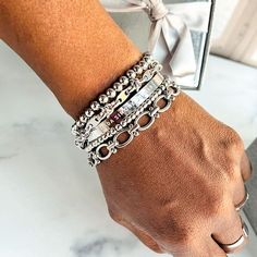 Give yourself options with the Chrisette Bracelet Stack. This bracelet stack features five dainty bracelets that are designed to mix and match for an assortment of styles. Wear just one, two or three - or stack them all for an extra pop! This braclet stack includes: - Nakia stainless steel beaded bracelet (4mm and 6mm) - Jada stainlesss steel bracelet - Lily stainless steel bracelet - Darla stainless steel bracelet Fits wrists up to 7.5 inches Bracelet size guide Silver Bracelet Stack, Bracelet Stacks, Stacked Earrings, Dainty Bracelets, Anklet Bracelet, Silver Pieces, Watch Necklace, Arm Candy, Bracelet Stack