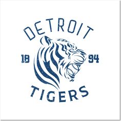 detroit tigers logo with the word detroit tigers in blue and white on a white background