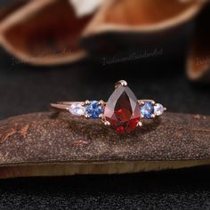 Vintage Pear Shaped Garnet Engagement Ring Unique Moonstone - Etsy Garnet And Sapphire Ring, Red And Blue Ring, Red Multi-stone Sapphire Ring, Red Sapphire Multi-stone Ring For Anniversary, Fine Jewelry Three Stone Wedding Gemstones, Red Multi-stone Sapphire Ring For Anniversary, Heirloom Sapphire Ring With Gemstone Accents For Wedding, Wedding Multi-stone Sapphire Gemstones, Elegant Three Stone Gemstones For Wedding