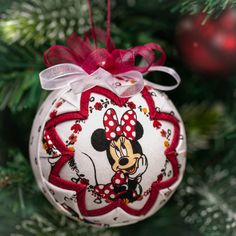 a minnie mouse ornament hanging from a christmas tree