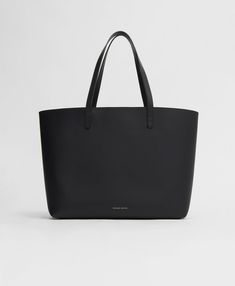 !!!Description---Lightweight and spacious with vibrant interior colors, this classic Mansur Gavriel piece is perfect for daily journeys. Fits a 16" laptop. !!!Fits---16" Laptop !!!Details---Top Width: 19 in / 48.3 cm Base Width: 13in / 33cm Height: 11.5 in / 29 cm Depth: 6 in / 15 cm Handle Drop: 9.5 in / 24 cm Composition: 100% Italian Vegetable Tanned LeatherMade in Italy !!!Materials--- Our Italian Vegetable Tanned Leather is a classic leather that shows its wear beautifully over time. It will not remain pristine and sleek, and although scratching will occur, we do not view these marks as defects. The patina created by daily wear-and-tear is meant to change and evolve over time. Mat And Nat, Mansur Gavriel Bag, Vibrant Interior, Interior Colors, Black Ballerina, Designer Totes, Wallet Gifts, Mansur Gavriel, Shoe Gifts