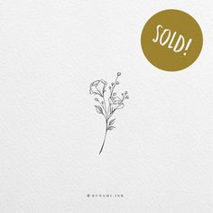 a white card with a gold circle that says sold on it and a flower in the middle