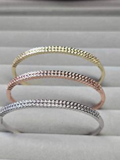 A beautiful bangle in three different colours  You can either wear as a set or wear individually  with cubic zirconia 2 rows  These are silver /rose gold /14k gold filled  Very good quality  They will not tarnish or turn green  60mm width  Great for a present,wedding,anniversary,birthday  Gold filled Stackable White Gold Bangle With Cubic Zirconia, Rose Gold Diamond Stackable Bangle, Rose Gold Cubic Zirconia Diamond Bangle, Stackable Rose Gold Diamond Bangle, Fine Jewelry Rose Gold Bangle With Cubic Zirconia, Stackable Rose Gold Diamond Bangle Bracelet, Silver Rose Gold, Tri Color, Diamond Bands