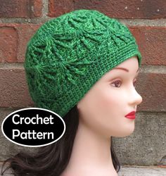 a mannequin head wearing a green crochet knitted beanie hat