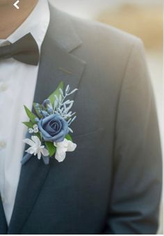 a man in a tuxedo with a boutonniere on his lapel