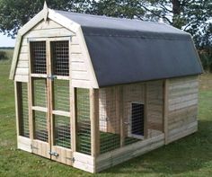 a small chicken coop in the middle of a field