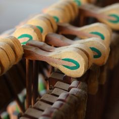 several wooden chairs with green arrows painted on them