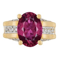 GIA Certified Oval Brilliant 7 Carat Purplish Red Tourmaline Ring, set in 18K Two Tone Gold. Adorned with 26 Round Cut Diamond Side Stones, Totaling 1.35 carats.  The center stone has a rich deep color saturation and minimal/none inclusions to the naked eye. Set in a 4-prong 18k solid gold mounting with a wide frame that contrasts the long oval cut dimensions of the center stone. `  GIA Item Description: Center stone set in yellow and white metal ring with numerous near-colorless round brilliant Wide Band Engagement Ring, Red Tourmaline, Silver Signet Ring, Contemporary Ring, Cabochon Ring, Gold Band Ring, Modern Ring, Tourmaline Ring, Metal Ring