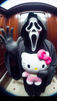 a hello kitty doll is being held up by a ghost