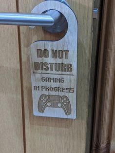 a wooden door with a sign that says don't disturb gaming in progress