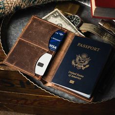 a passport, credit card and wallet sitting on top of a table