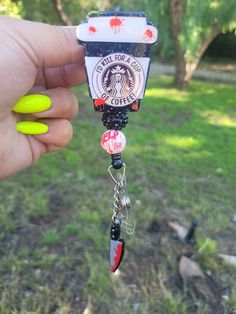 "Super Cute Meyers coffee badge reel Approximately 2\" tall. Beads may vary. Check out the cute matching pen under pens.  Badge reels are attached with 3M dual lock velcro and are interchangeable. If you prefer a permanent glue please send me a note when you purchase. CAUTION: All items have small parts. Please do not leave children unattended. These small parts could cause a choking hazard. Care instructions: Please avoid dropping, while items are durable, they are not indestructible. Please handle with care. Different colors available. Send me a message for customs. RETURNS/EXCHANGES: Due to all items being personalized and made to order we do not accept returns or exchanges. If there are any issues with your order you must notify us within 24 hours of delivery. Thank you! CHANGE OF ADDR Themed Black Badge Holders For Gift, Novelty Black Badge Reel For Gift, Themed Black Badge Reel For Gifts, Themed Black Badge Reel For Gift, Themed Black Badge Reel As A Gift, Themed Black Badge Reel Gift, Fun Black Badge Reel For Gifts, Cute Horror, Horror Gifts