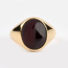 A beautiful Garnet signet ring - Recommended by Etsy! *real images of the ring, taken by us* Garnet Stone Size: 12x10mm Material: - 9K Gold (375) - 14K Gold (585) - 18K Gold (750) *All signet rings are hallmarked on the back for certification* - We offer FREE Worldwide DHL & FedEx Shipping! - Branded DanelianJewelry Gift Box with each order! Our customer service is available 7 days a week. Leave us your message, and we will get back to you within a little time. ✔️ Tracking number ✔️ Worldwide sh Luxury Red Signet Ring With Polished Finish, Formal Oval Signet Ring With Polished Edges, Classic Ruby Ring With Polished Finish For Formal Occasions, Classic 14k Gold Signet Ring With Cabochon, Classic Yellow Gold Signet Ring With Cabochon, Classic Formal Gemstone Signet Ring, Classic Formal Signet Ring With Gemstone, Classic Opal Ring With Polished Oval Cabochon, Classic Oval Ring With Polished Edges